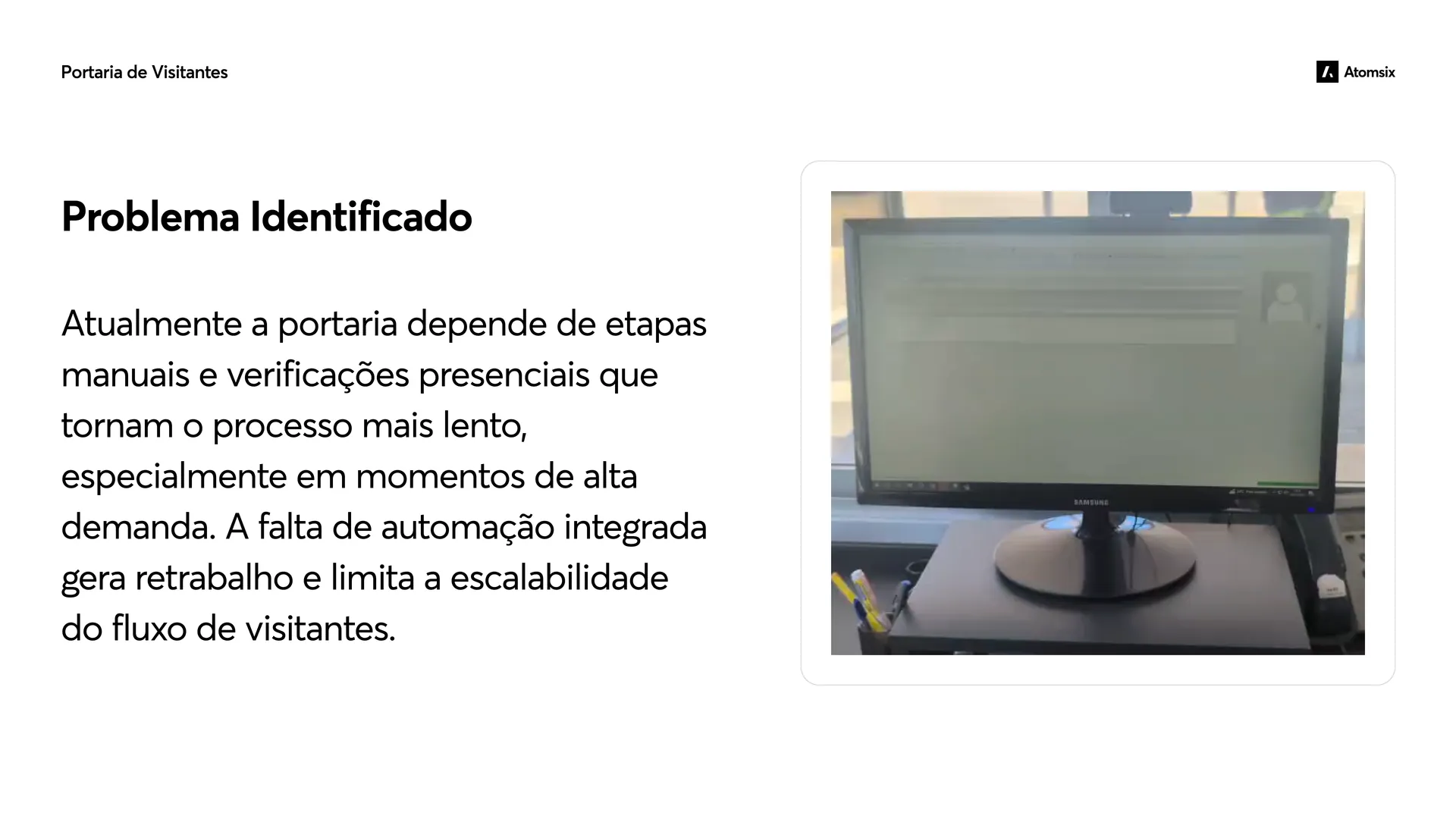 "Problem identified" slide with the text about the manual gate and a photo of an old computer at the reception
